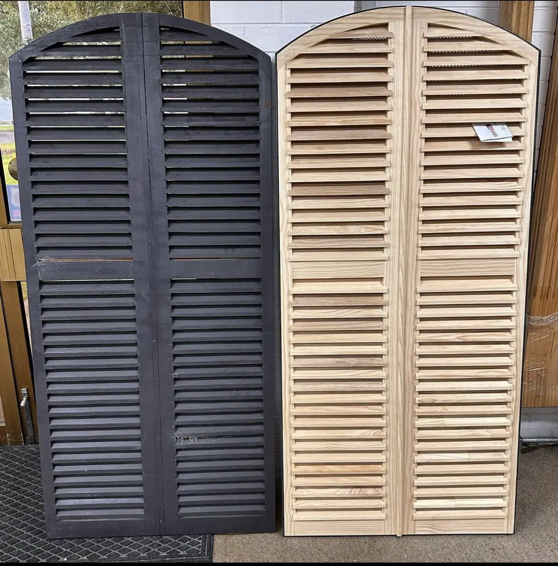 Original painted and replacement natural timber arched louvre doors side by side